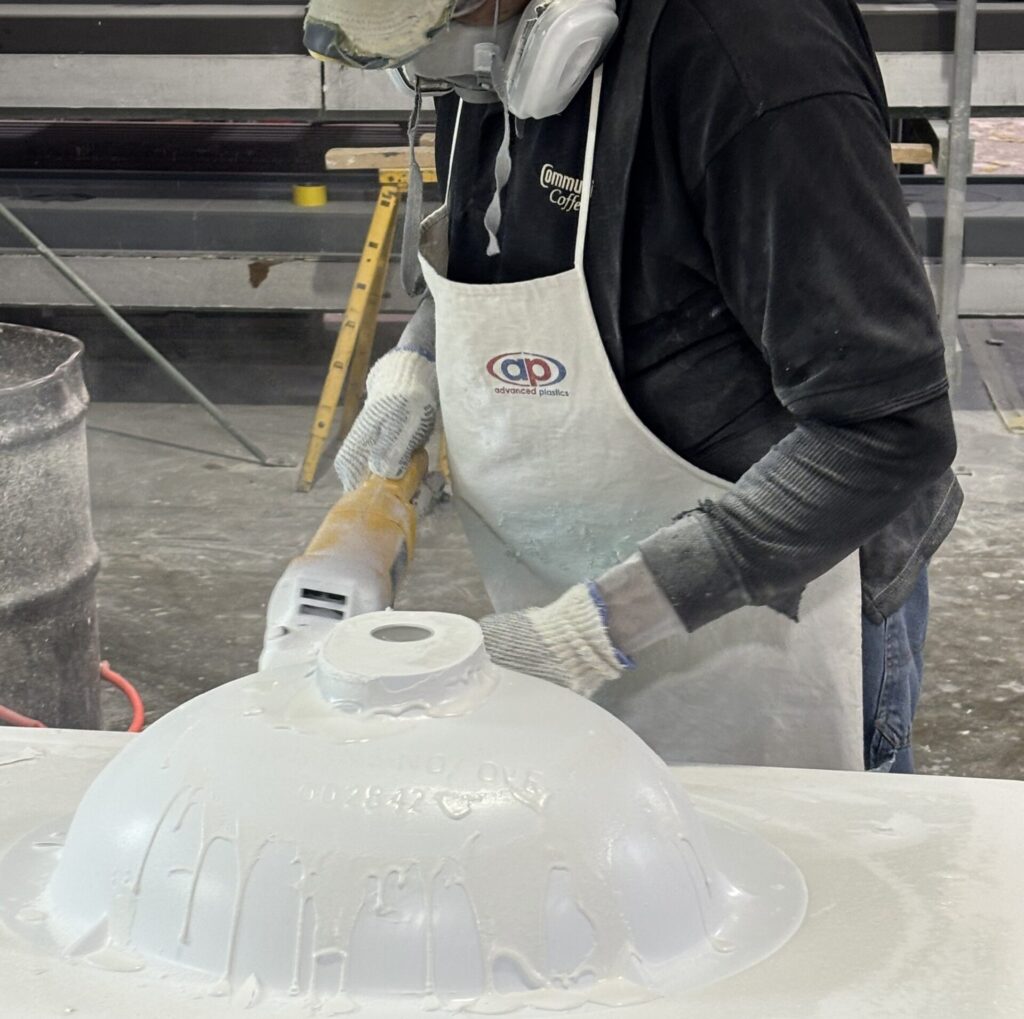 Top Marble craftsman working on a cast marble sink
